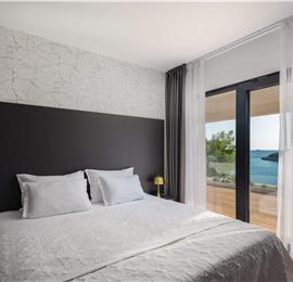 Luxury Beachfront Villa with Heated Infinity Pool near Trogir, Sleeps 8